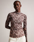 JUMILA-Tops-JUMILA is the ultimate in feminine style. Figure hugging fabric and our exclusive Wings print come together in this dainty top, which features a high neckline, long sleeves, and stretch fabric. This wardrobe staple can be can be worn with anything from tailored trousers to floaty skirts.The fabric of this product is made with 96% recycled polyester. Using recycled polyester helps divert plastic waste from ending in landfills and helps us to reduce our dependency on virgin materials. Fitted mesh